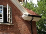 Decorative fascias and soffits dentil mouldings with black ogee guttering Haslemere Surrey