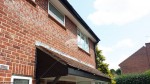 Black Ash fascia with White tongue and groove soffit and Black UPVC squareline guttering in Romsey, Hampshire