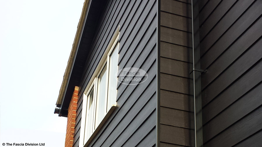 Black Hardieplank cladding, Black Ash fascias and soffits with Black replacement guttering Oxford