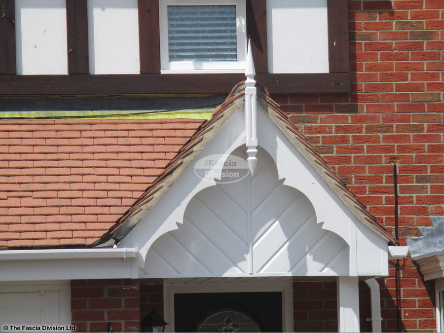 Decorative bargeboards with roof spire and herringbone cladding