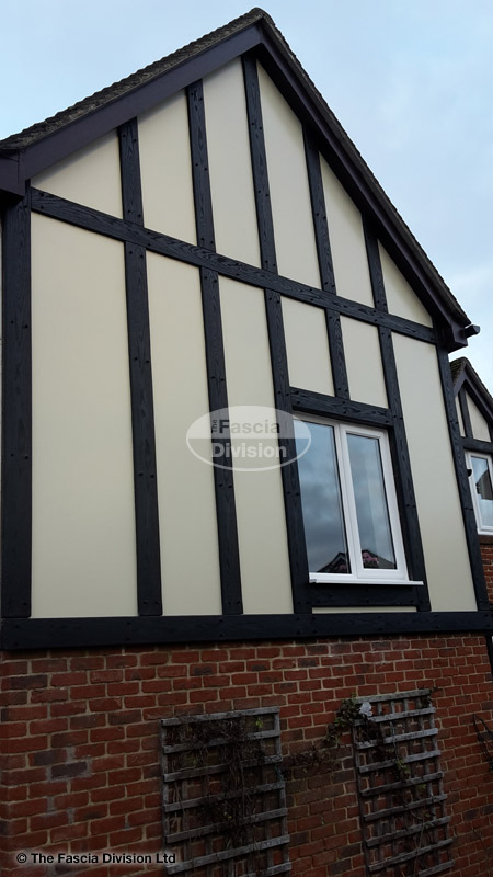Installation of new mock tudor beams with cream composite render panels