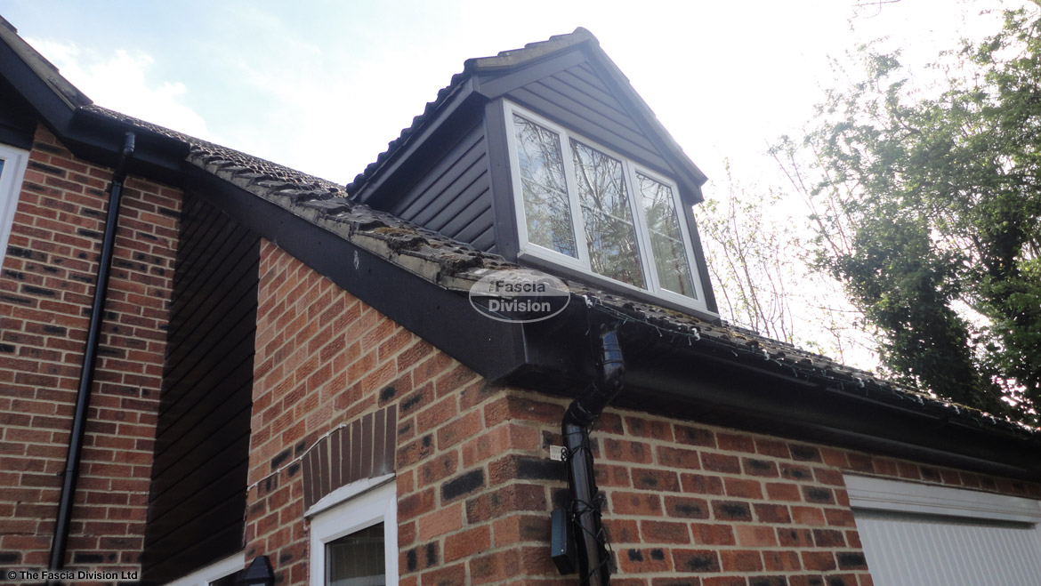 Black ash cladding, replacement fascias, soffits and guttering