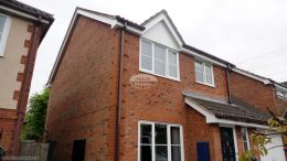 UPVC white herringbone cladding, white UPVC fascias and soffits with brown square guttering