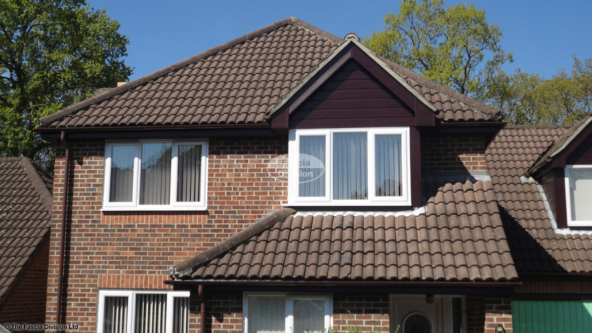 rosewood UPVC shiplap cladding, fascias, soffits and UPVC brown guttering