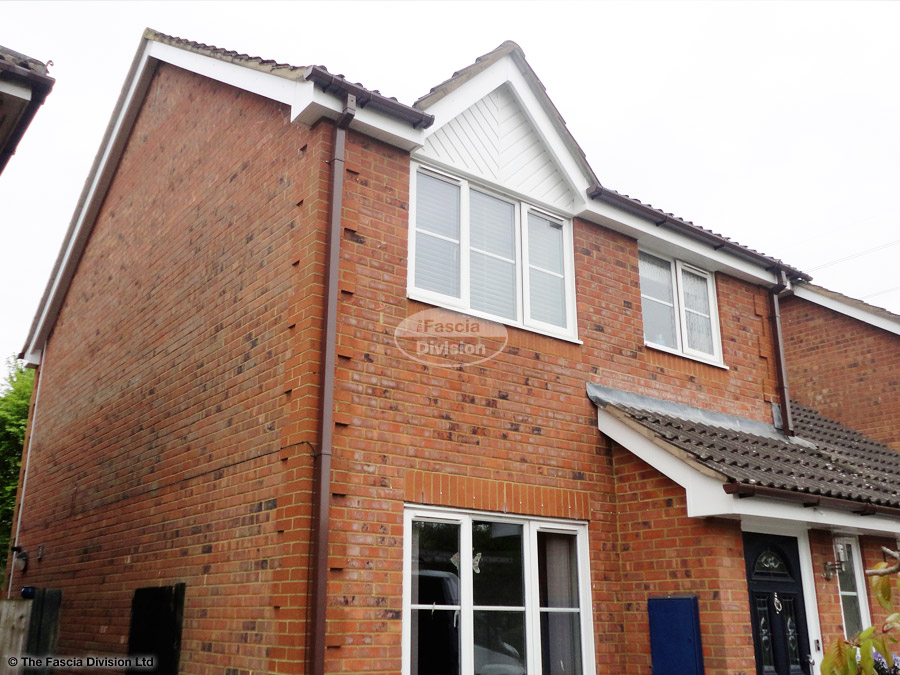 Installation of UPVC white fascia and soffit with brown square guttering in Eversley Installation of UPVC white fascia and soffit with brown square guttering in Eversley