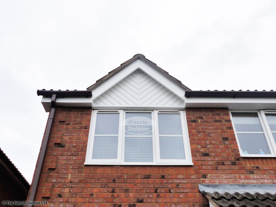 Installation of UPVC white herringbone cladding and white fascia in Eversley