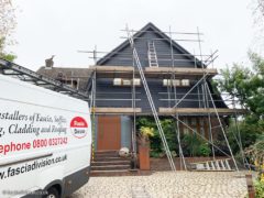 Black hardieplank weatherboard cladding installation