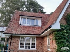 white fascia and soffit with black guttering