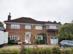 white flat soffit with continuous guttering installation