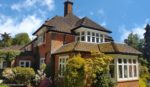 black guttering with white fascias and soffits