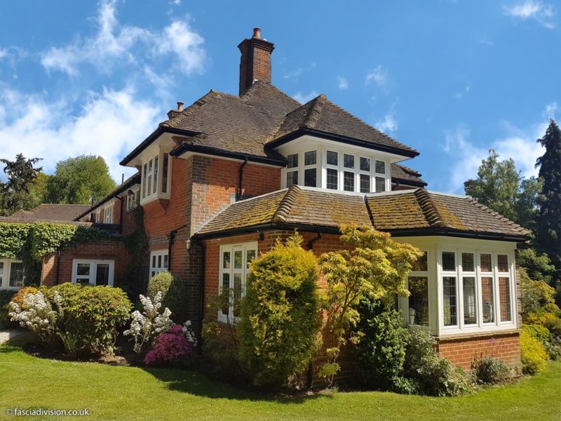 black guttering with white fascias and soffits