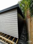 Hardieplank cladding to side of outbuilding with anthracite Skybond sheets