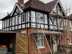 Semi-detached house with new Mock Tudor boards and white render board