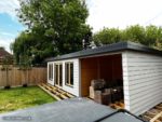 Timber outbuilding with weatherboard cladding installation in Chichester