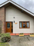 Weatherboard cladding installation on front of property