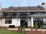 New black upvc fascias, soffits and guttering with GRP roof spires