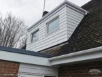 White Hardieplank cladding on the dormer window