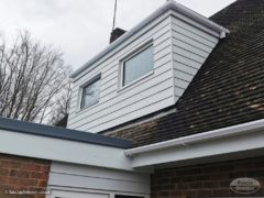 White Hardieplank cladding on the dormer window