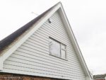 Roof apex with white cladding and white fascia, soffit and guttering