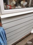 New white Hardieplank Cladding under a window