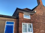 Anthracite Fascia with seamless guttering on corner of a school