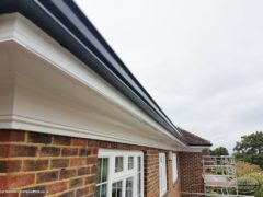 White fascias and soffits with black seamless guttering