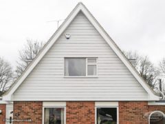 Roof apex with white cladding and white fascia, soffit and guttering