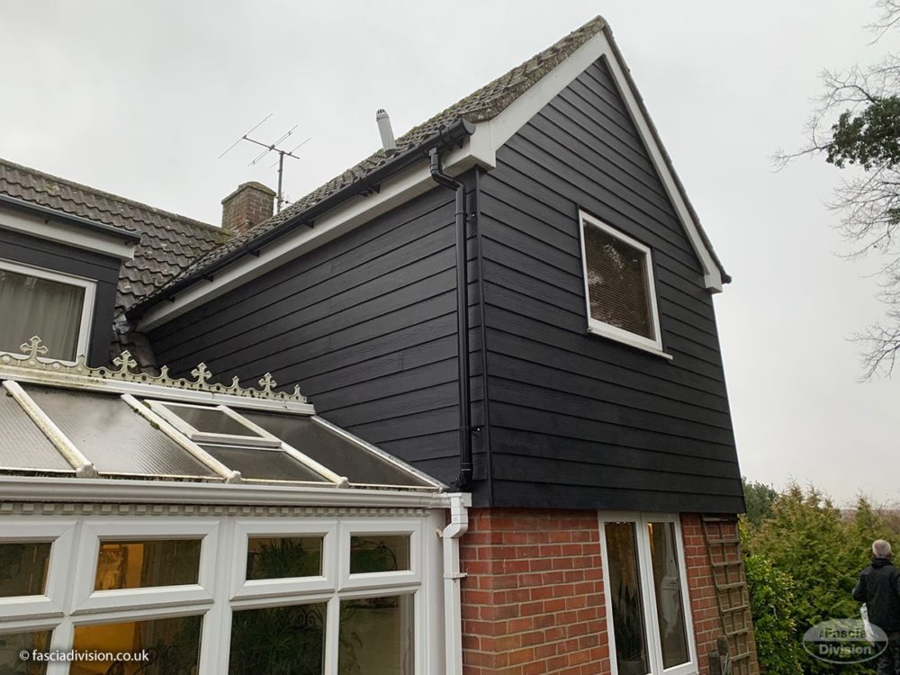 Midnight Black Hardieplank cladding, white fascias and soffits