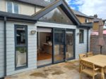 Anthracite fascia, soffits and guttering with Light Mist Hardieplank cladding