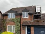 Black fascia, soffits and guttering installation on a detached house