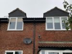 Black UPVC cladding on two dormer windows