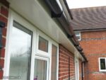 white flat soffits black guttering