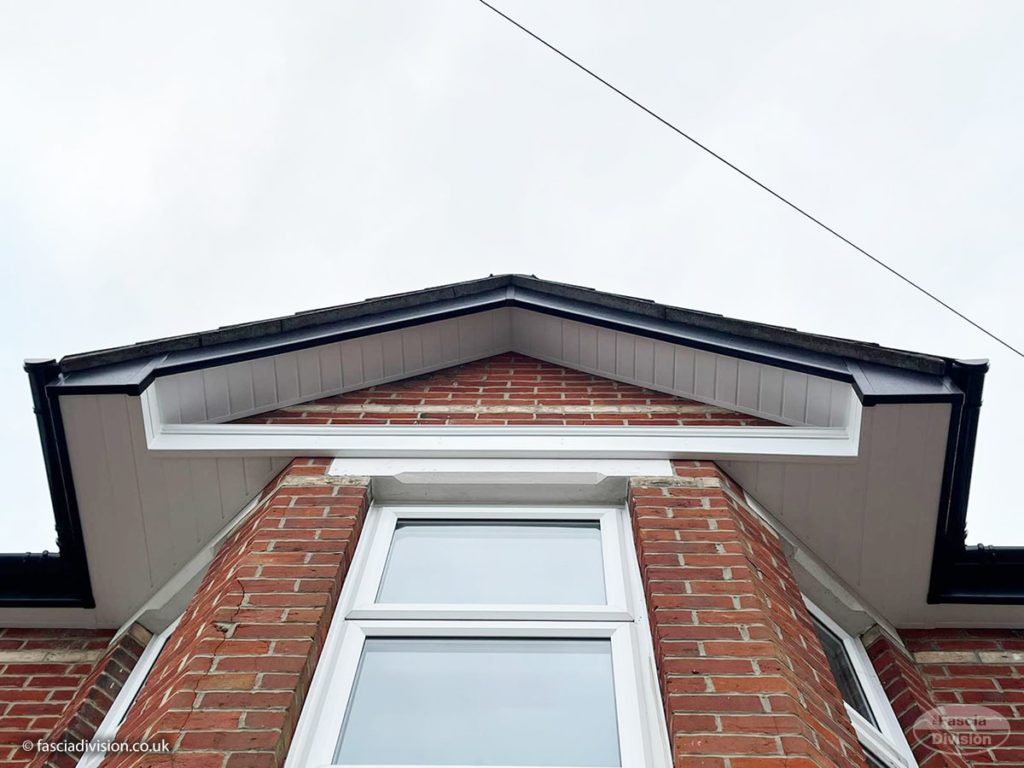 Black UPVC fascia with white soffits on gable-end