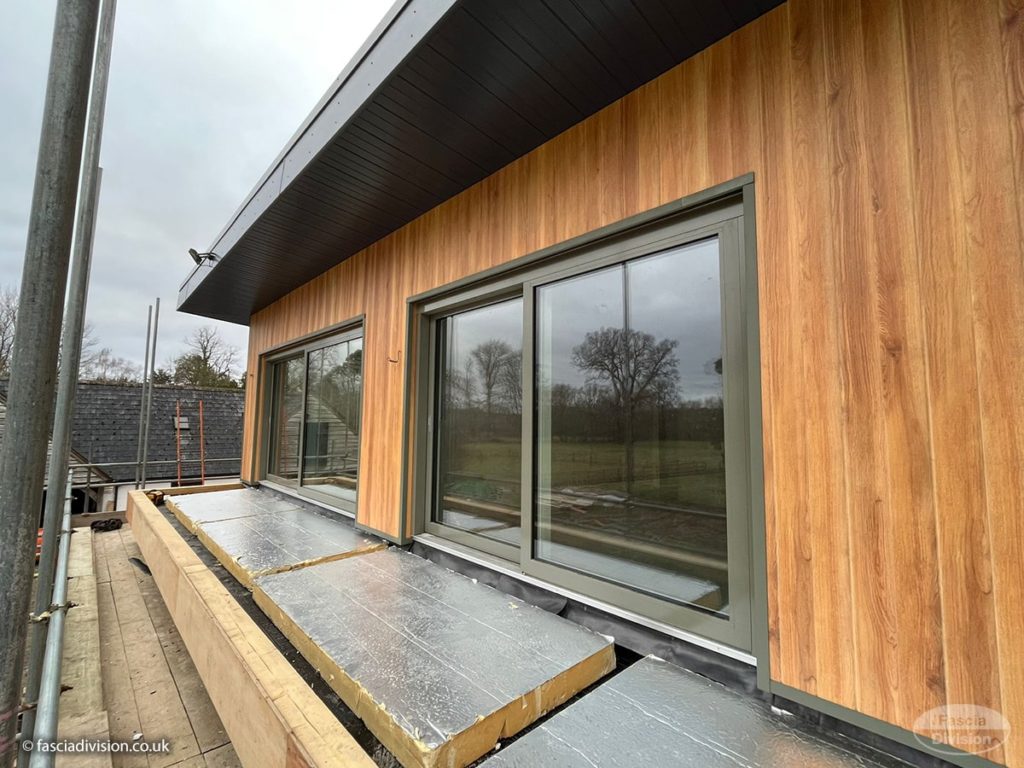 Durasid Foresta cladding in Red Cedar, anthracite fascias and soffits