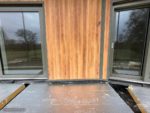 Durasid Foresta cladding installed vertically with trims which match the windows