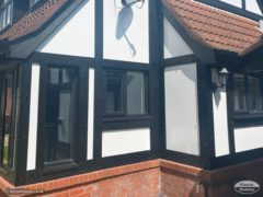 black mock Tudor and black fascias and soffits