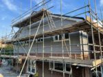 Grey Durasid cladding on a detached house