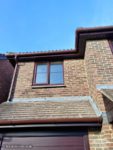 Rosewood fascias and soffits with brown round guttering