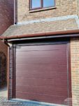 Rosewood upvc fascias and soffits with brown guttering on a garage