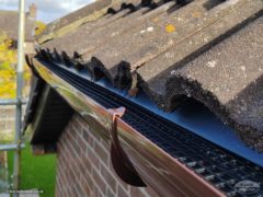 new UPVC guttering showing eaves tray just below tiles and gutter guard