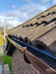 UPVC guttering showing eaves tray just below tiles and gutter guard