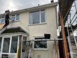 Soft green Hardie Plank cladding on semi-detached house