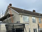 Soft green Hardie Plank cladding on semi-detached house