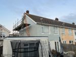 Soft green Hardie Plank cladding on semi-detached house