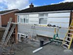 installing new rigid insulation before cladding installed