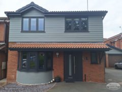 New slate grey cladding, windows, fascia, soffit and guttering