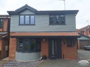 slate grey Hardie Plank, anthracite fascia, soffits, guttering and windows