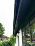 Colour matched soffits with black deep flow gutters