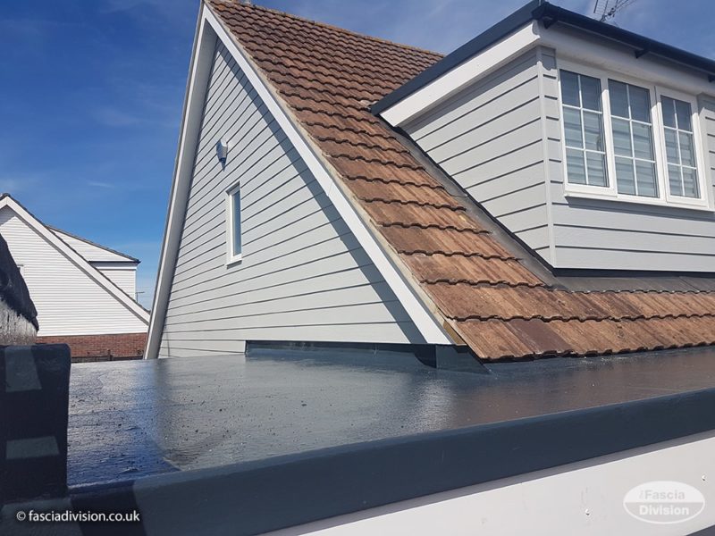 New Hardie plank cladding with new GRP flat roof on garage