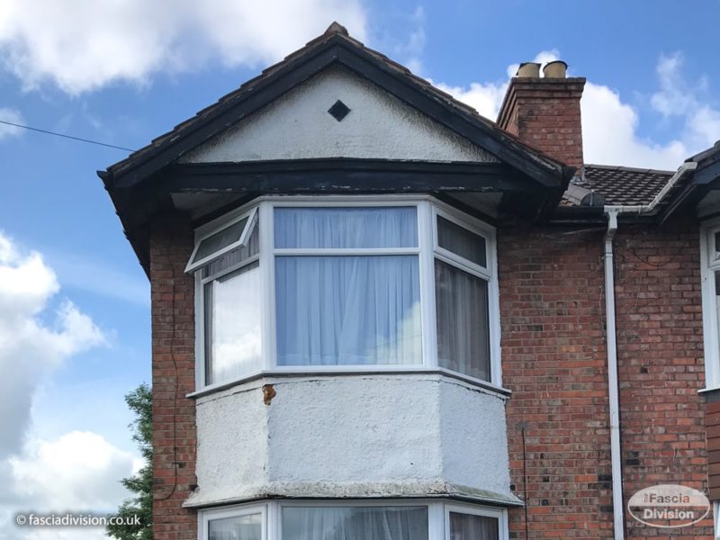 Old wood fascia and soffits before replacement